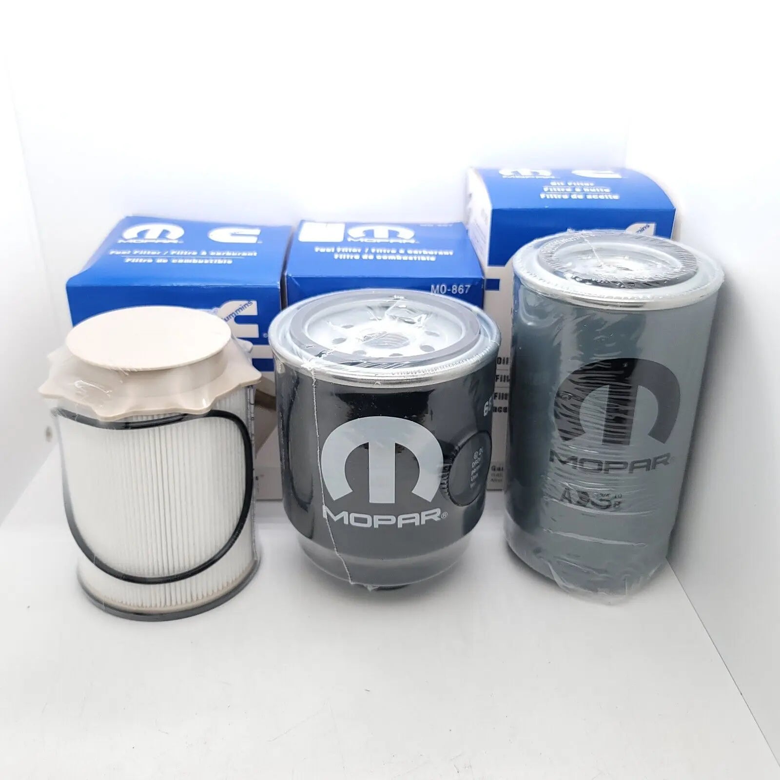 Oil Filter, Fuel Filter, and Water Separator Set for 6.7L Cummins Diesel - OEM quality for Ram trucks, available at Mopar Truck Filters.