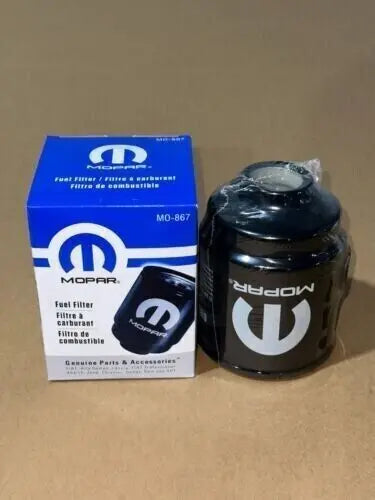 Installed OEM Fuel Filters on 6.7L Cummins Diesel Engine - Front and rear filters from Mopar Truck Filters for efficient filtration.